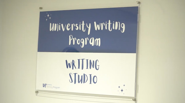 A wall sign saying 'university writing program. Writing studio'